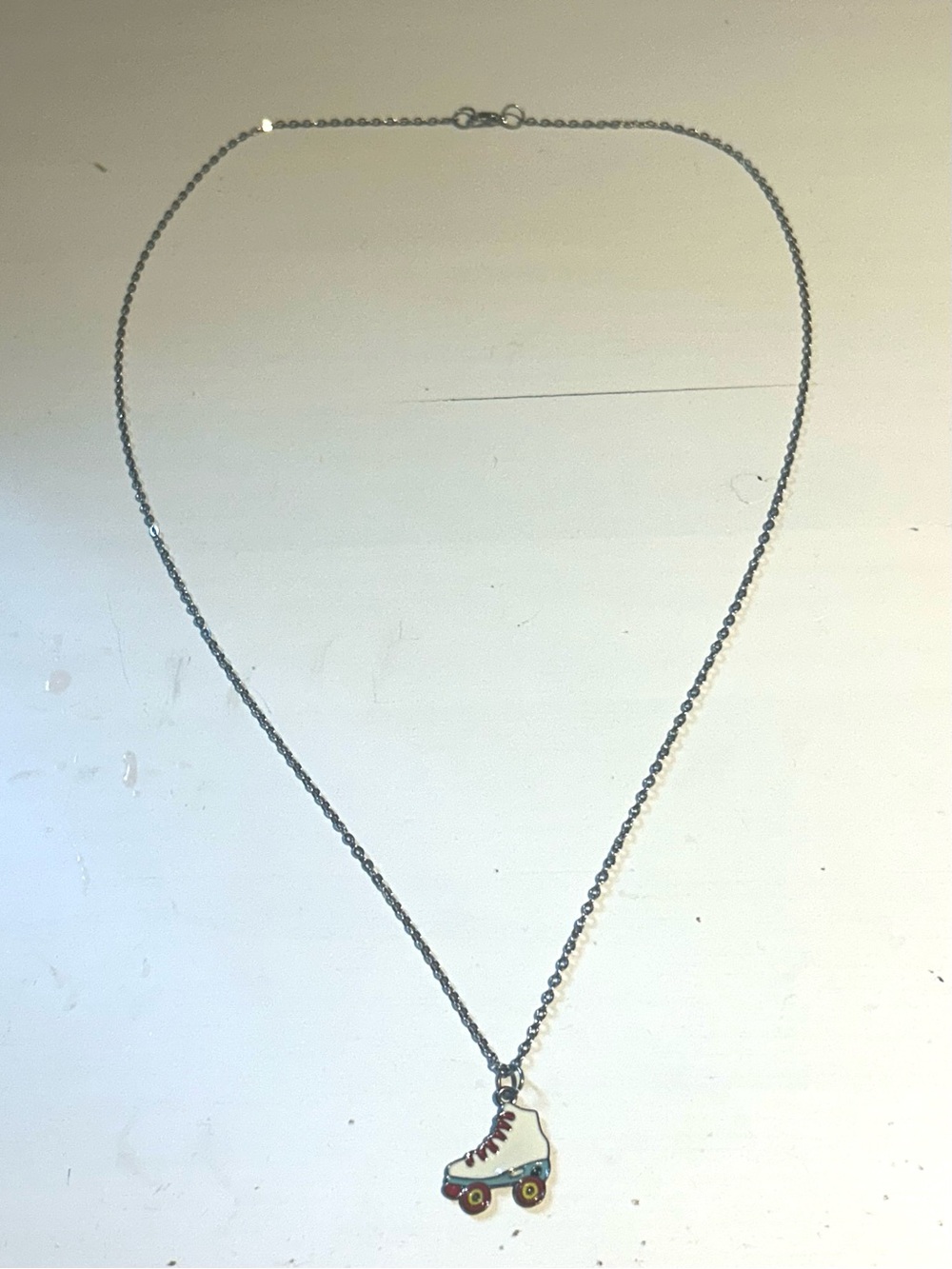 Cute silver skate necklace